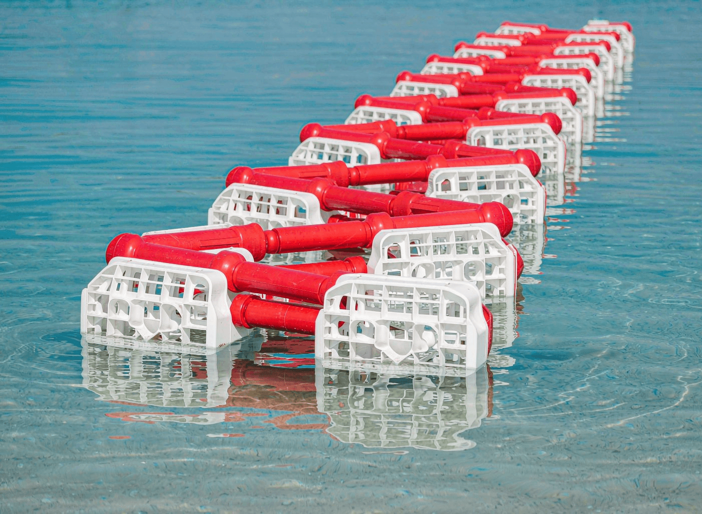 Floating HDPE track barriers