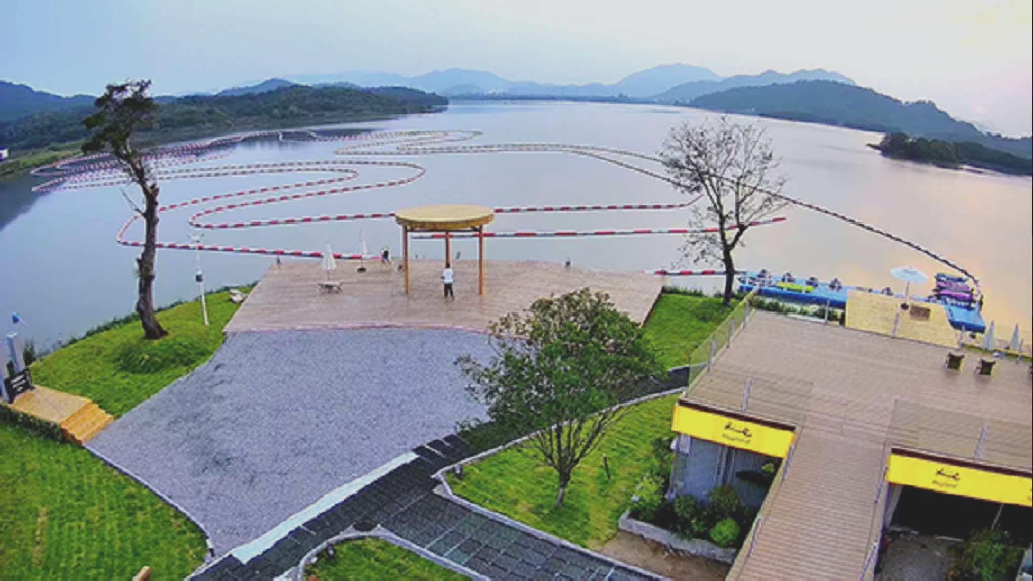 Lakeside resort venue with a full kart boat race track and waterfront deck